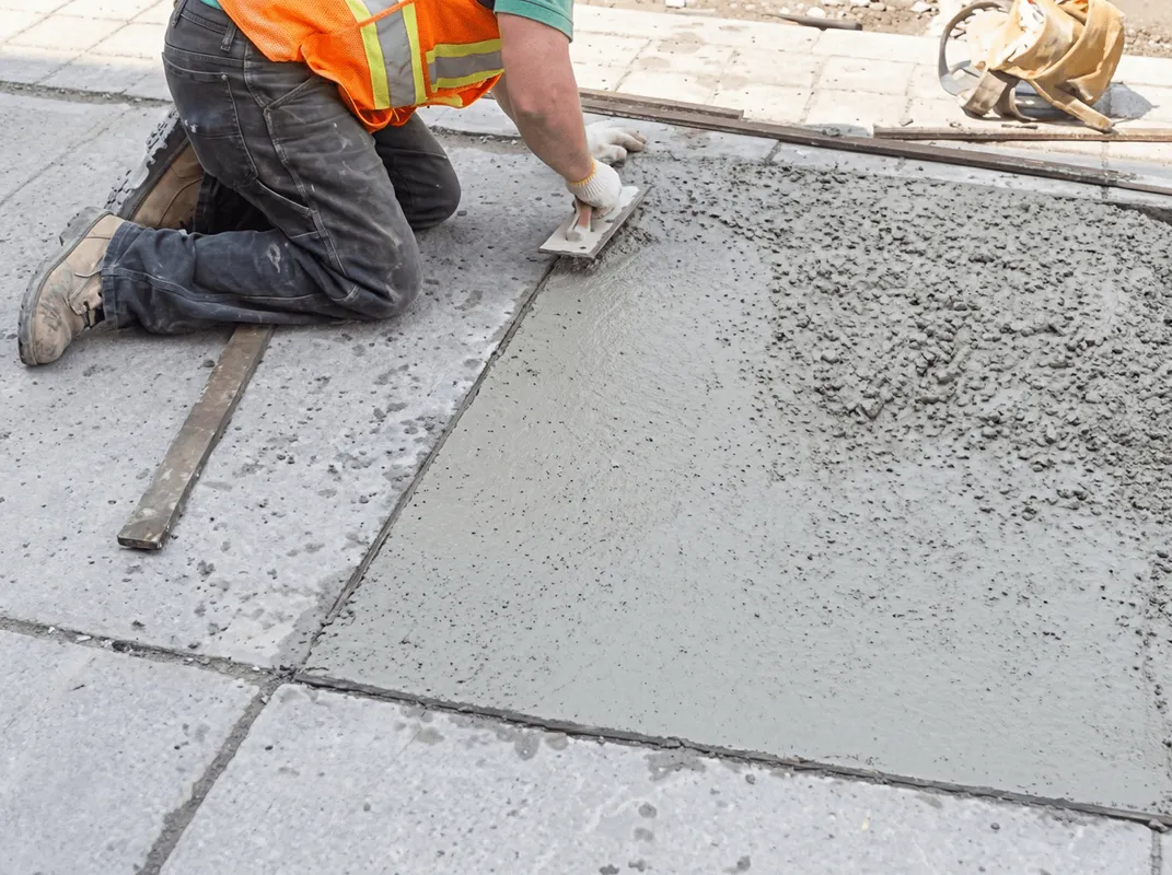 Professional repairing a concrete floor in ,